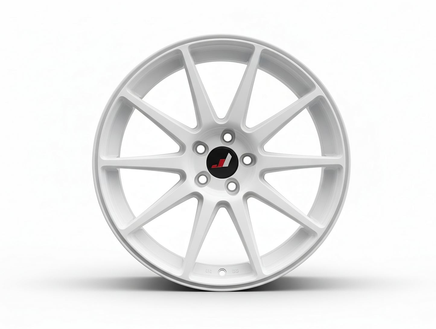 Weiße Alufelge im Mehrspeichen-Design, frontal fotografiert